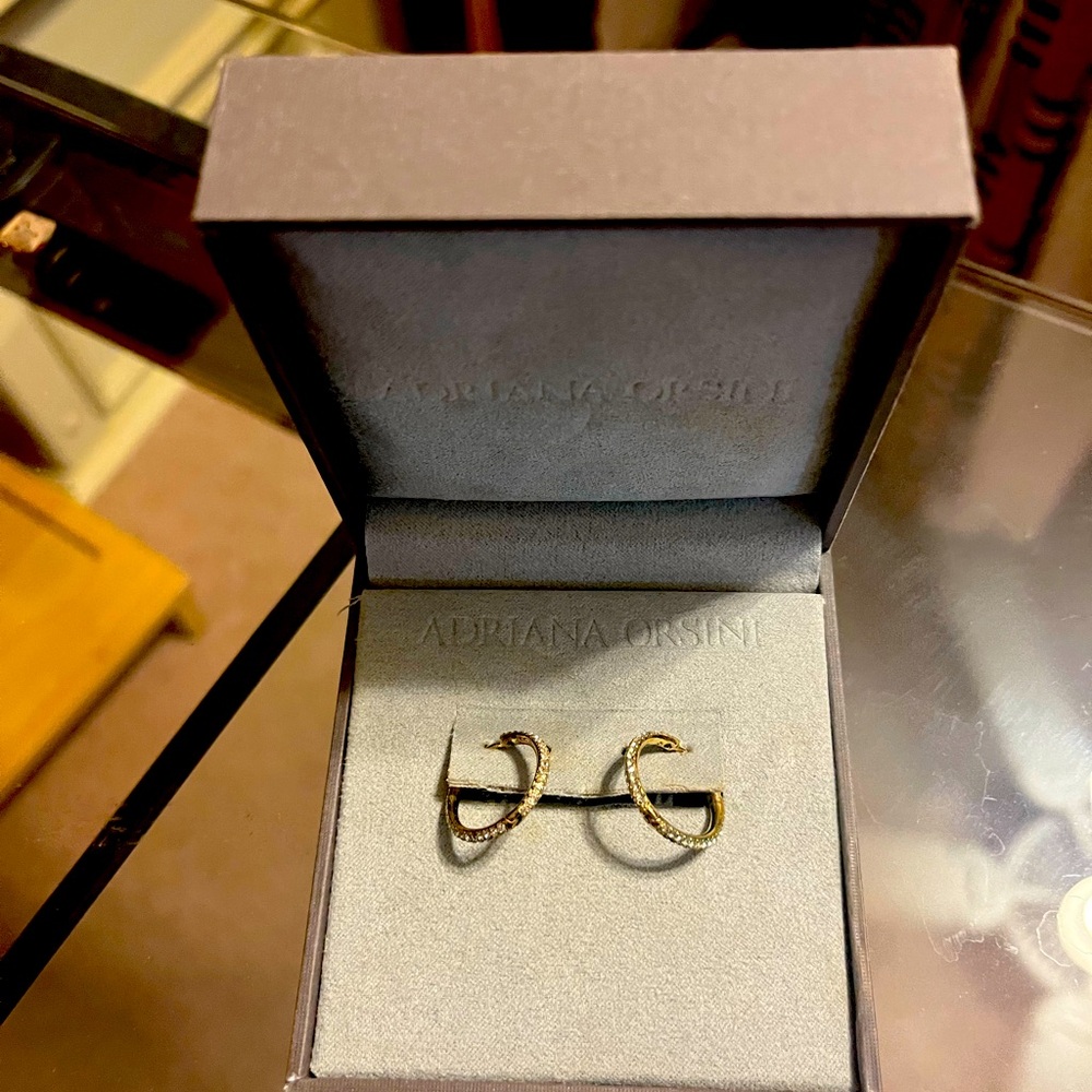 Authentic Adriana Orsini huggie earrings with eternity cubic zirconia
